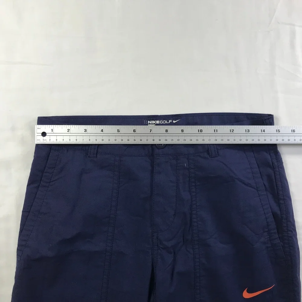Nike Men's Navy Cargo Pants with Orange Swoosh Accent